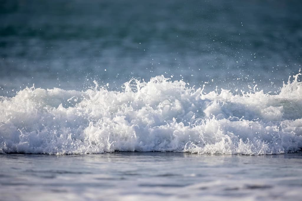 Ocean waves, foamy, blue sea
